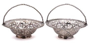 A pair of silver swing-handled sweetmeat baskets,maker W.
