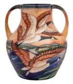 A limited edition Moorcroft pottery two handled vase: tubelined after a design by Philip Gibson
