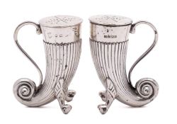 A pair of Victorian silver cornucopia peppers, maker Horace Woodward & Co, Birmingham,