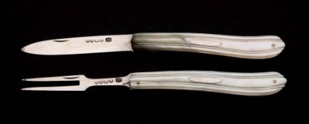 A Victorian folding Silver fruit knife and fork, maker James Fenton, Sheffield,