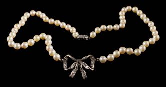A cultured pearl single-string necklace centring a white gem-set ribbon bow: approximately 33gms
