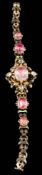 A mid 19th Century gold and pink foiled topaz bracelet: with graduated oval pink foiled topaz in
