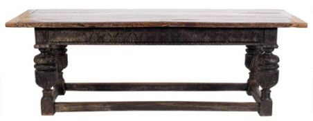 A 17th Century and later oak refectory table:, with an overhanging plank top,