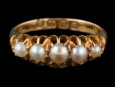 An 18ct gold and seed pearl mounted five-stone ring: in claw setting,