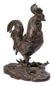 A Continental bronze inkwell in the form of a cockerel: the hinged head with glass inset eyes
