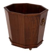 A mahogany octagonal jardiniere in the Regency taste:,