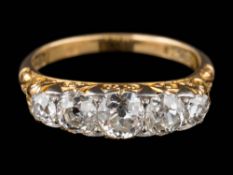 An 18ct gold and graduated diamond five-stone ring: with round old, brilliant-cut diamonds,