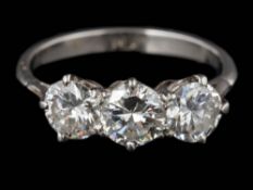 A diamond three-stone ring: with round, brilliant-cut diamonds each approximately 0.40ct, 0.