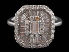 An 18ct white gold and diamond rectangular cluster ring: set with tapered baguette-cut and round,