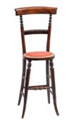 A William IV simulated rosewood child's correction chair:, the back with plain curved bar top rail,
