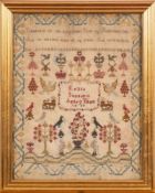 A William IV needlework sampler: with verse, the central cartouche surrounded by flowering shrubs,