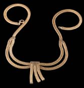 A 9ct gold necklace centring a triple tassel drop: on bolt ring clasp,