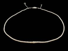 A graduated pearl, single-string necklace: the pearls graduate from 1.3mm to 4.