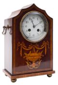 An Edwardian French mantel clock: the eight-day duration movement striking the hours and half-hours