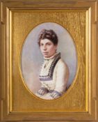 An English porcelain plaque: of oval form finely painted with a half portrait of a lady wearing an