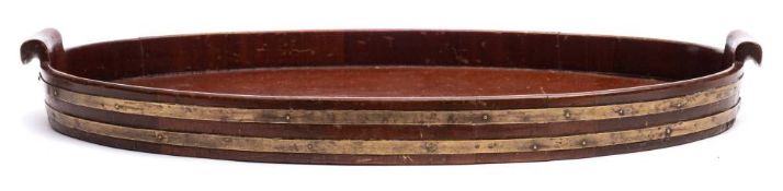 A Georgian mahogany oval tray: of coopered construction,