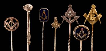A collection of 12 Masonic gold and gilt metal stick pins: to include an enamelled rose-diamond