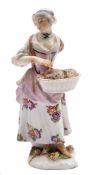 Two Meissen figures: the first of a shepherdess, wearing a yellow bodice,