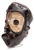 A Bena Lulua ( Democratic Republic of Congo) carved hardwood mask: with protruding forehead, eyes,