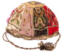 A late 17th/early 18th century embroidered purse: of panelled design each with floral motifs framed