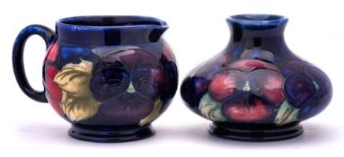 A Moorcroft pottery small vase and jug: of squat form and each tubelined in the Pansy pattern