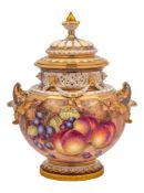 A Royal Worcester pot-pourri vase and cover: painted with peaches and grapes on a mossy ground,