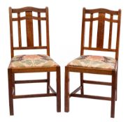 Heal & Son, London W A pair of Edwardian oak dining chairs:,