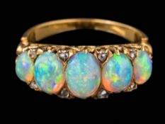 A graduated opal five-stone ring: the oval opals graduate from approximately 5mm long to 7.