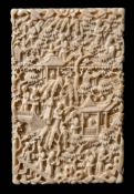 A 19th century Cantonese carved ivory card case: with all over decoration of figures in a pagoda