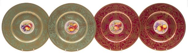 A pair of Royal Worcester cabinet plates and a similar pair the first pair painted with panels of