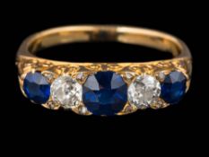 A sapphire and diamond five-stone ring: with graduated, oval sapphires and round old,