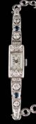 A lady's Art Deco sapphire and diamond cocktail wristwatch: the rectangular dial with Arabic