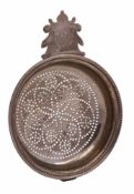 A George IV silver lemon strainer, no maker's mark, London, 1822: initialled, with beaded border,