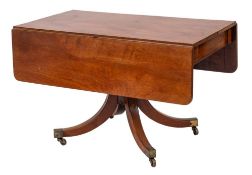 A Regency mahogany drop flap breakfast table:, the hinged top with rounded corners,