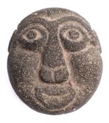 A Polynesian carved basalt stone head: probably Maquesas Islands or Hawaii, 20th century,