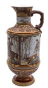 A large Mettlach stoneware ewer, signed 'Warth': with oak branch handle, moulded,