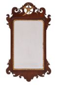 A 19th Century mahogany and partly gilt fret-cut mirror: with Ho-ho bird and shaped cresting,