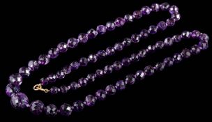 A graduated faceted amethyst bead,