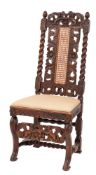 A 19th Century carved walnut dining chair in the Carolean taste:,