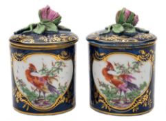 A pair of Derby toilet/pomade pots and covers: of cylindrical form with bud finials,