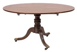 A Regency mahogany oval breakfast table:, the snap top with a reeded edge,