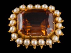A citrine and split pearl mounted rectangular brooch: the rectangular citrine approximately 20mm