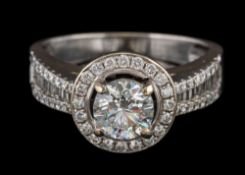 A diamond mounted halo cluster ring: the central brilliant-cut diamond approximately 0.
