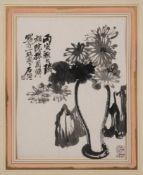 A Chinese painting of chrysanthemums arranged in a vase in the style of Shitao: in a garden with