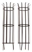 A pair of wrought iron tree guards:, of cylindrical lattice design, 174cm (5ft 8 1/4in) high,