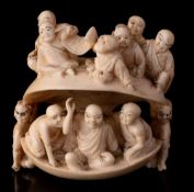 A large Japanese carved ivory netsuke of a clam,