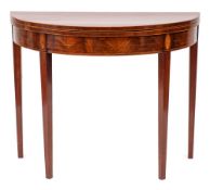 A George III mahogany and inlaid half round tea table: bordered with boxwood lines,