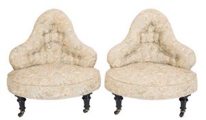 A pair of Victorian ebonised frame conversation chairs:,