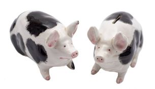 Two Bovey Tracey Wemyss pottery pigs: of small stature one, in the form of a money box,