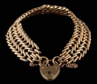 A 9ct gold bracelet with heart-shaped padlock clasp and safety chain: approximately 23gms gross